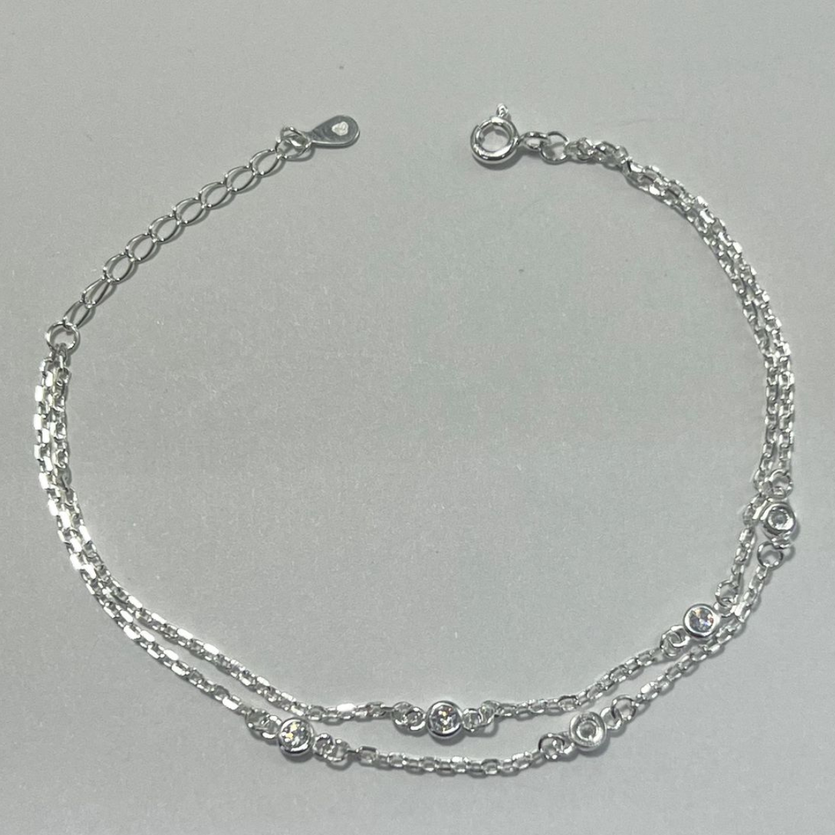 TOBILLERA DOBLE EN PLATA CON CIRCONES