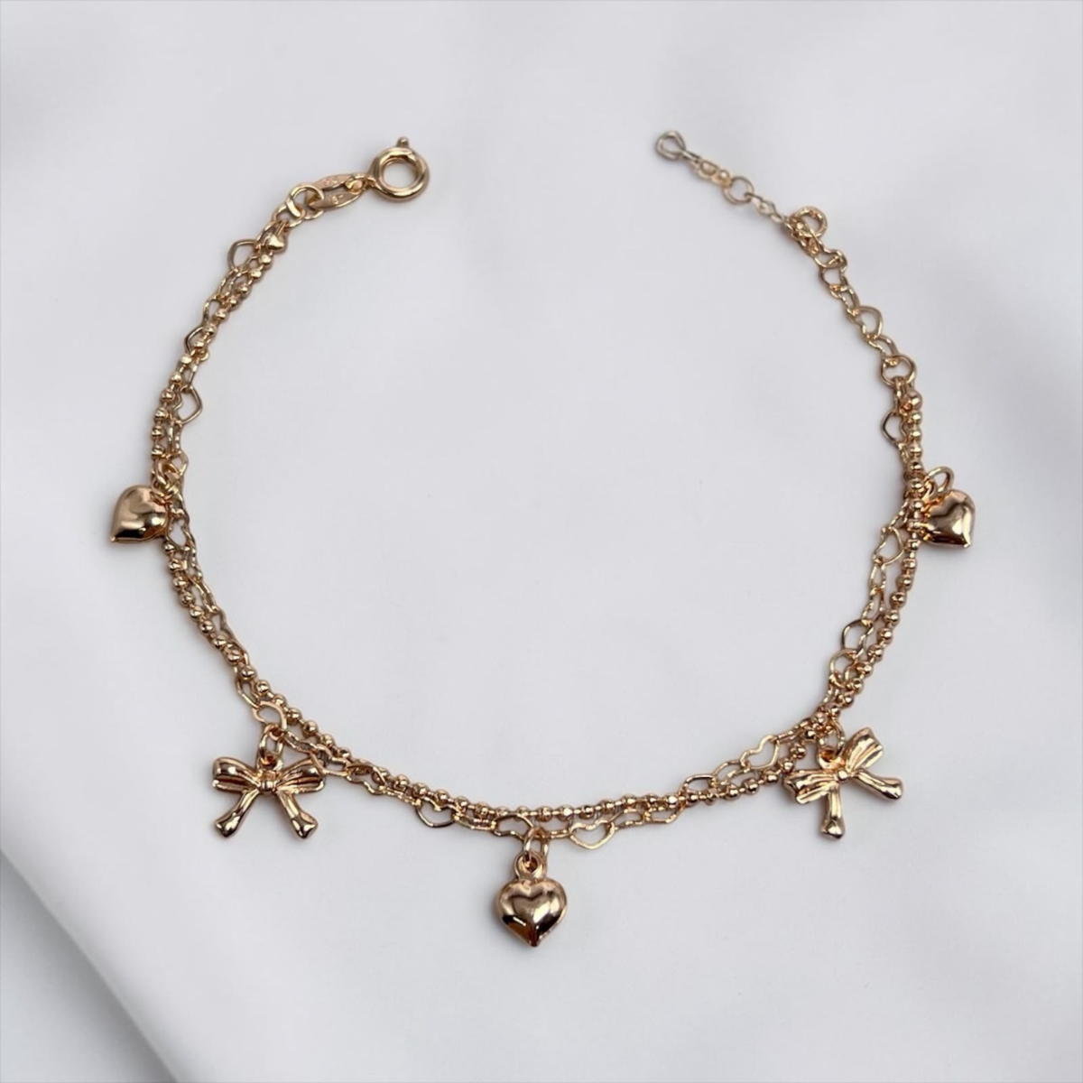 PULSERA DIJE MOÑO Y CORAZON COLGANTE ORO LAMINADO 18K