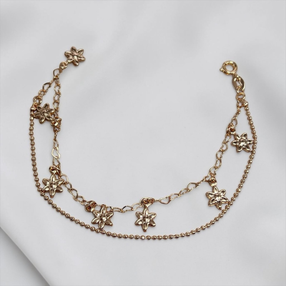 PULSERA DIJE FLOR COLGANTE ORO LAMINADO 18K
