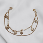 PULSERA DIJE FLOR COLGANTE ORO LAMINADO 18K